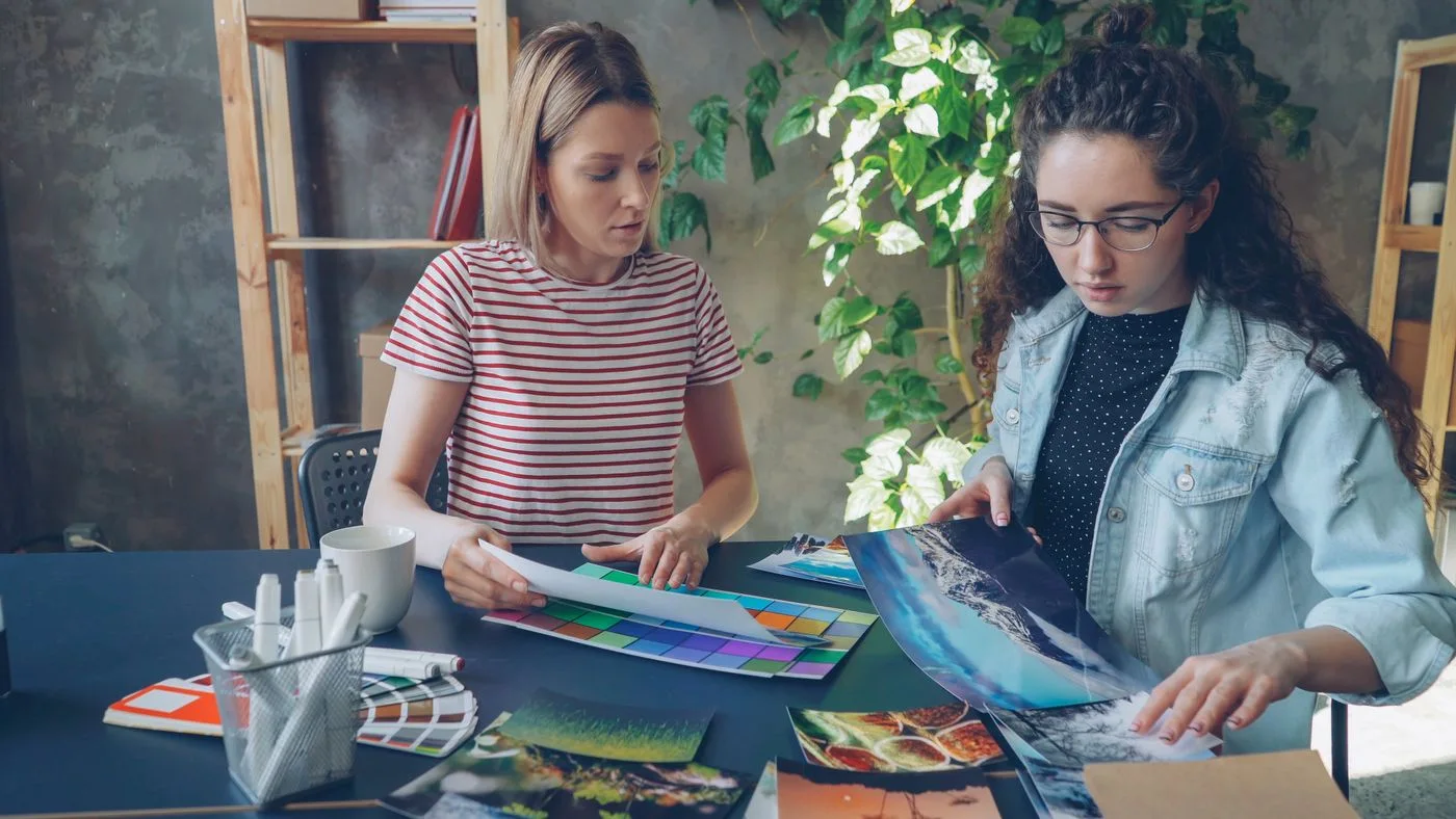 Designers comparing printed creative options