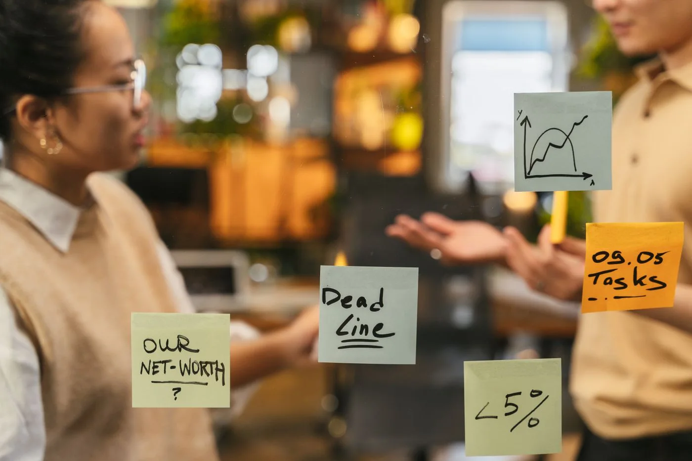 Discussion notes arranged on a glass wall