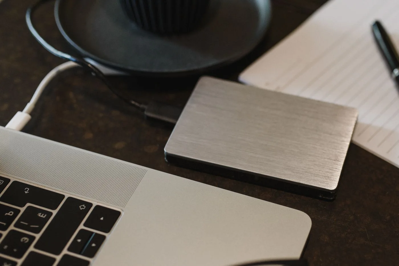 An external drive connected to a laptop