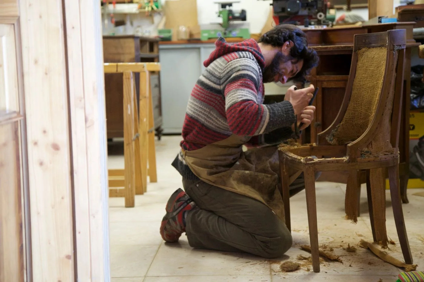 Restoring a wooden chair in a workshop