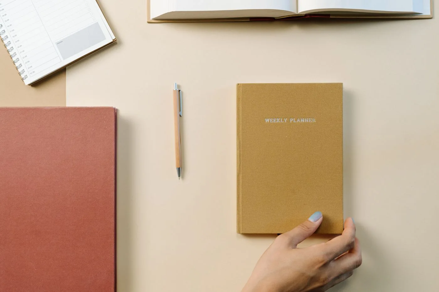A weekly planner and writing materials