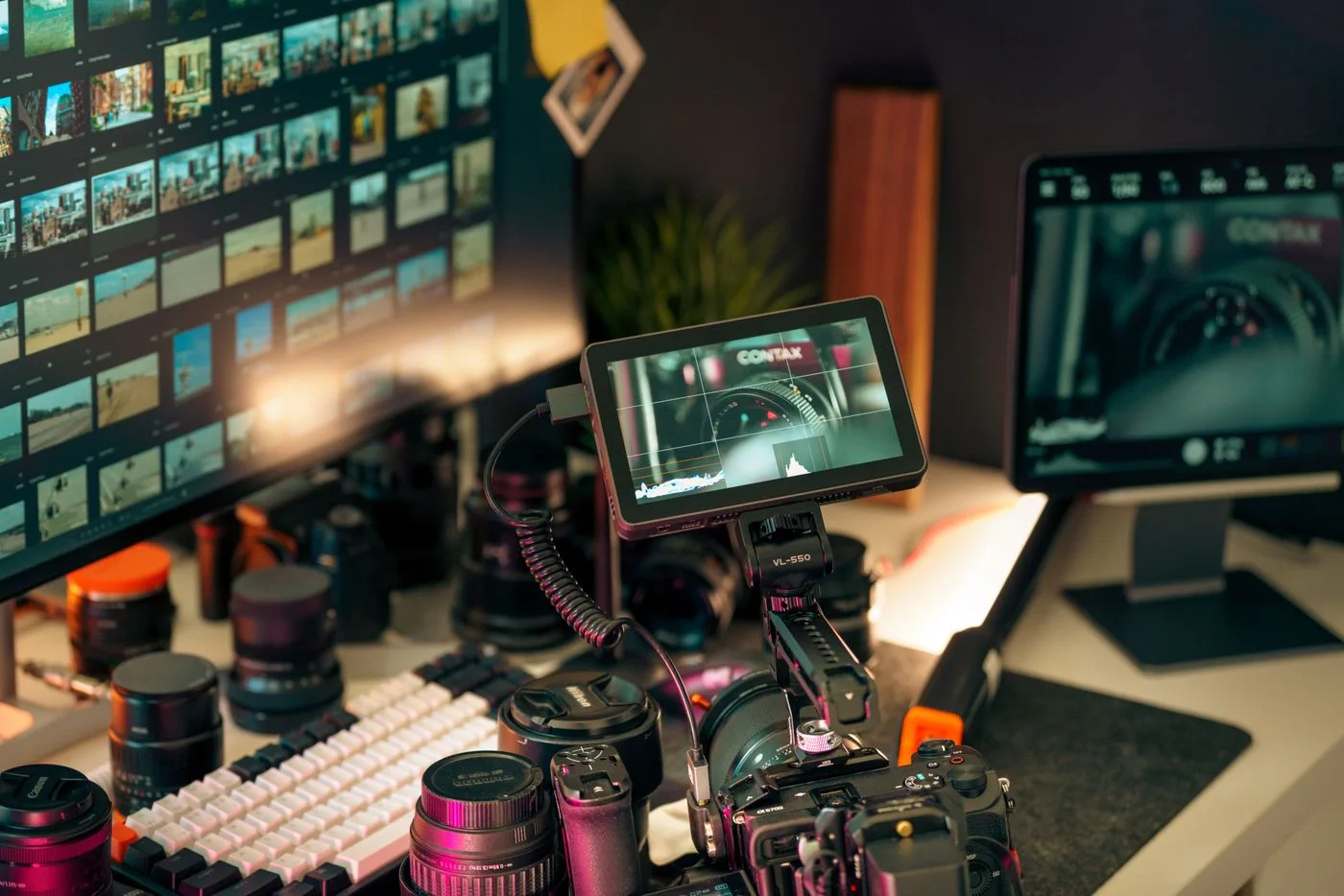 A photography workspace with monitors and cameras