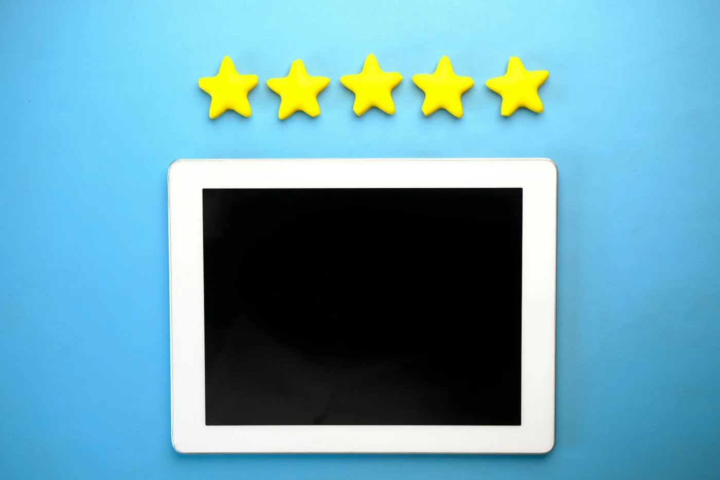 Five rating stars above a tablet