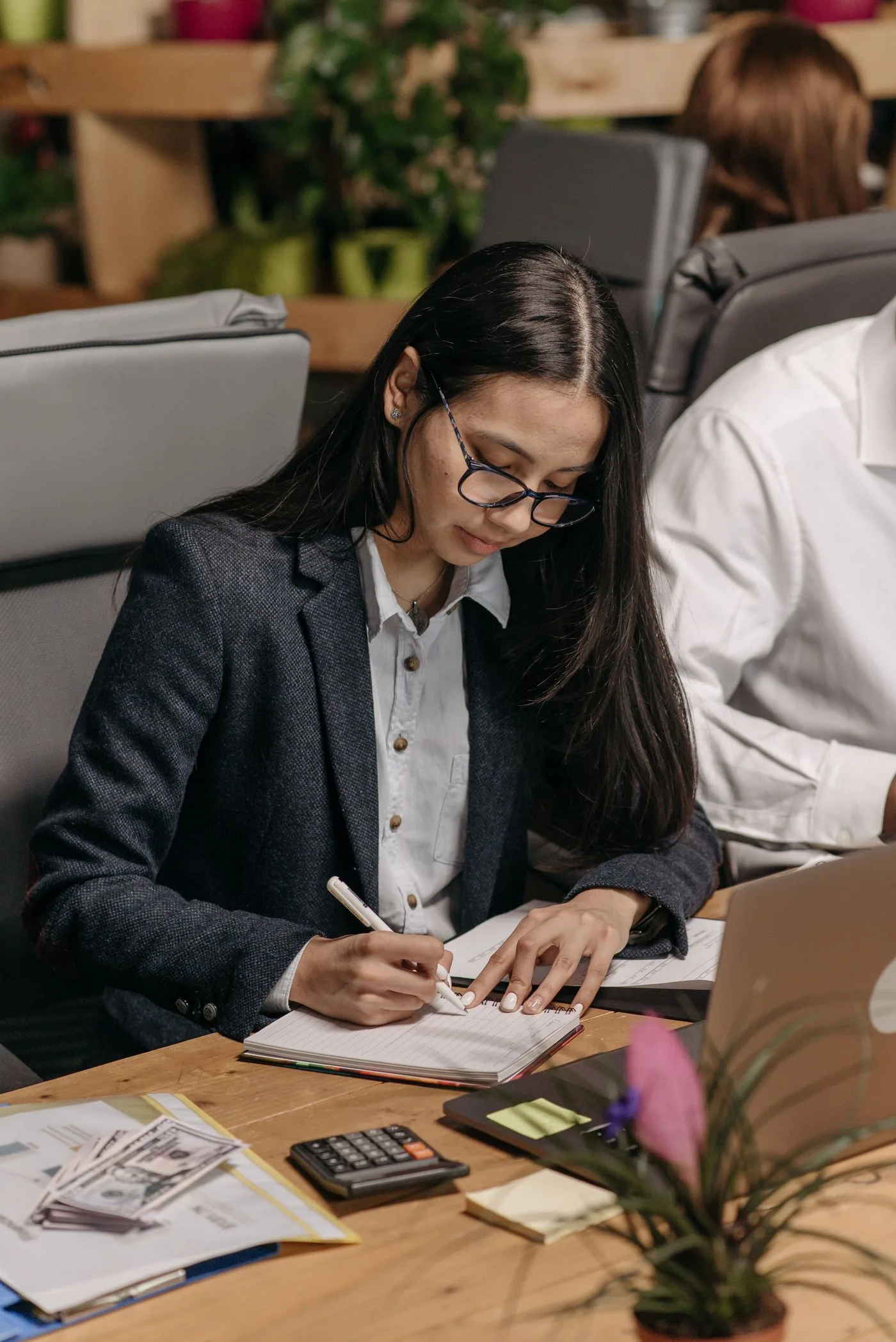 Preparing written notes at a desk