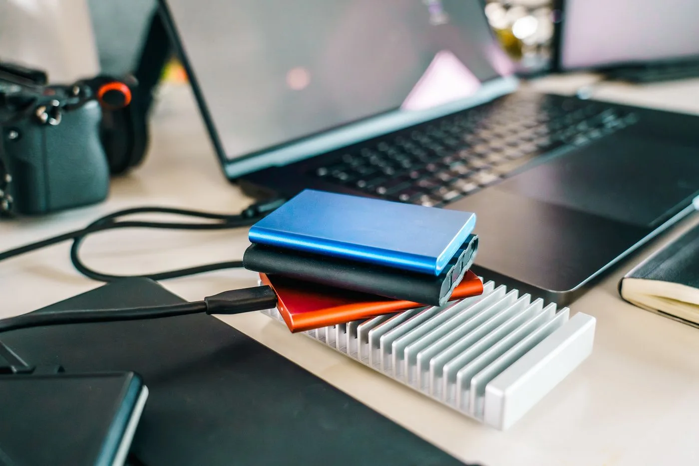 Data storage devices beside a laptop