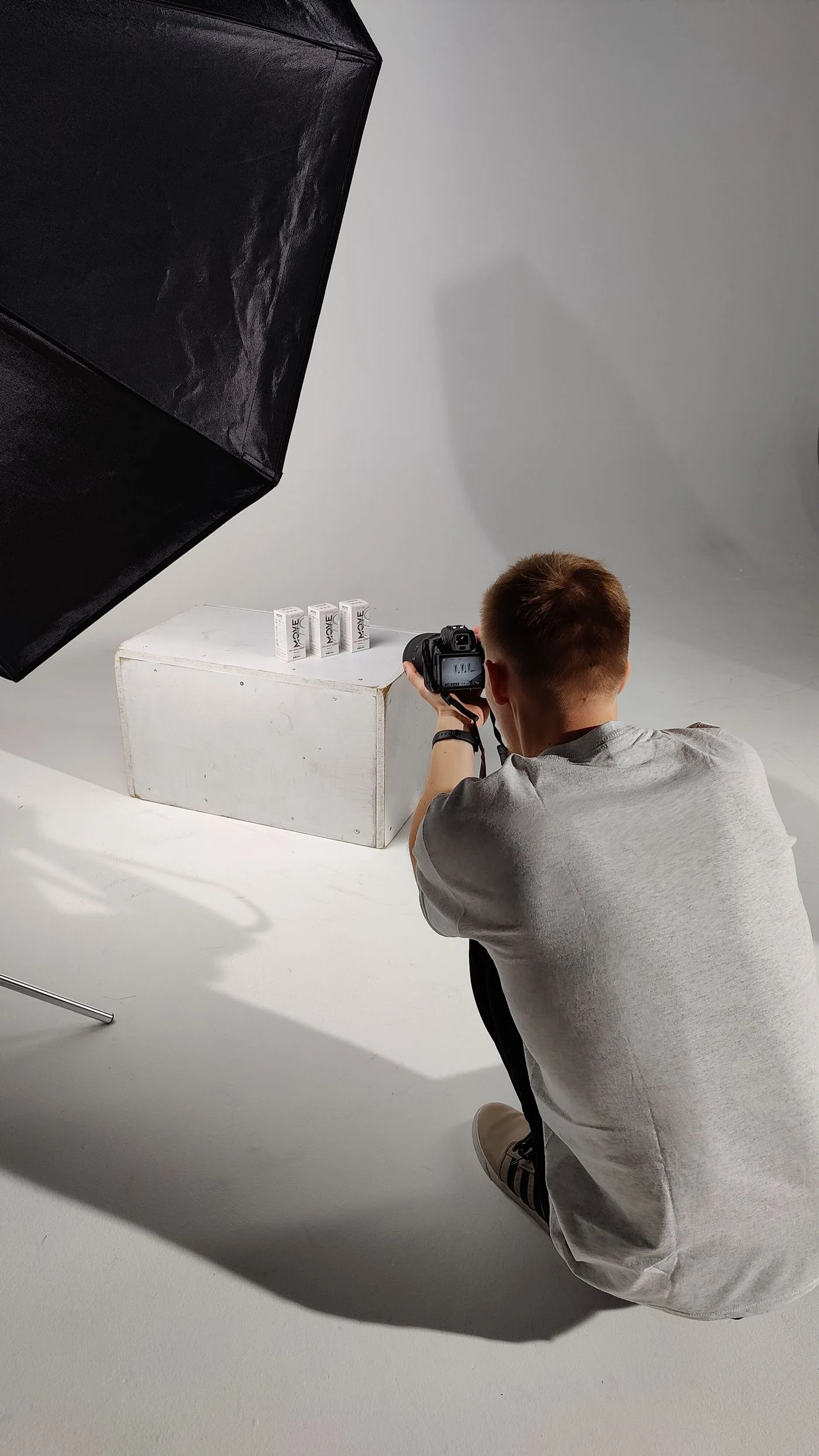 A photographer preparing a product shoot