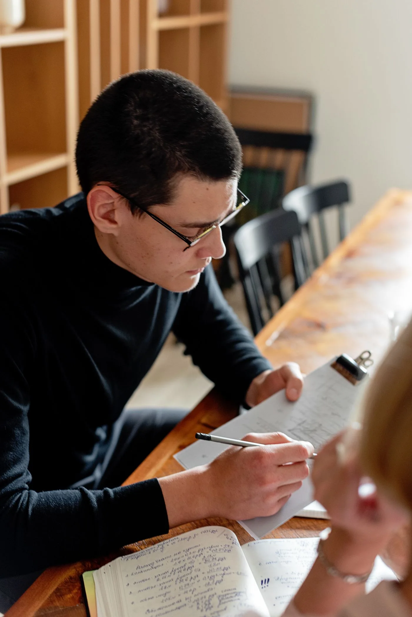 Taking notes on a business clipboard