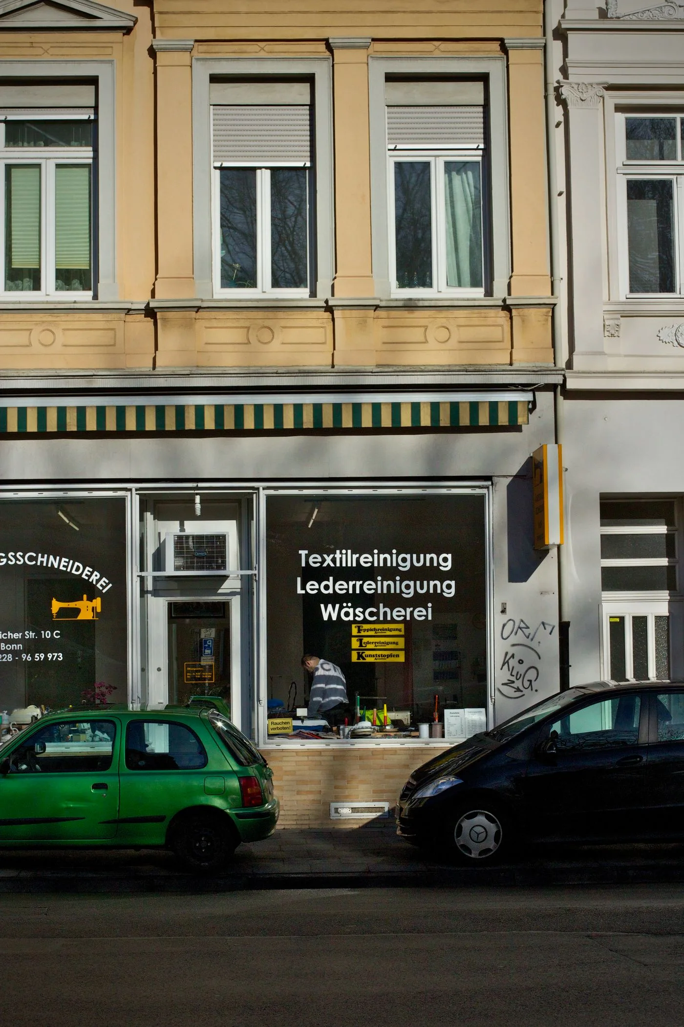 A local dry-cleaning shop on a street
