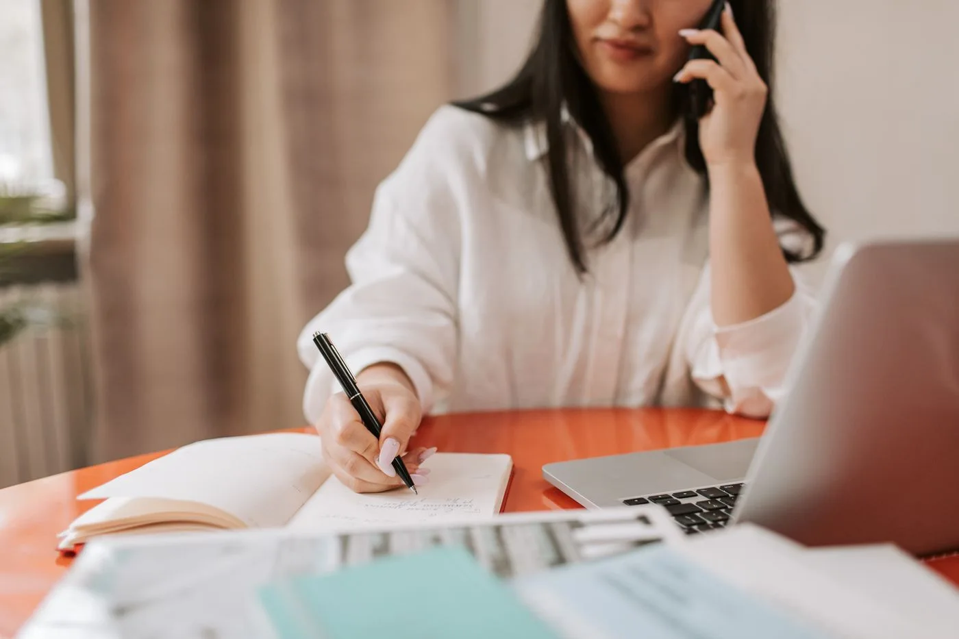 Writing notes during a business call