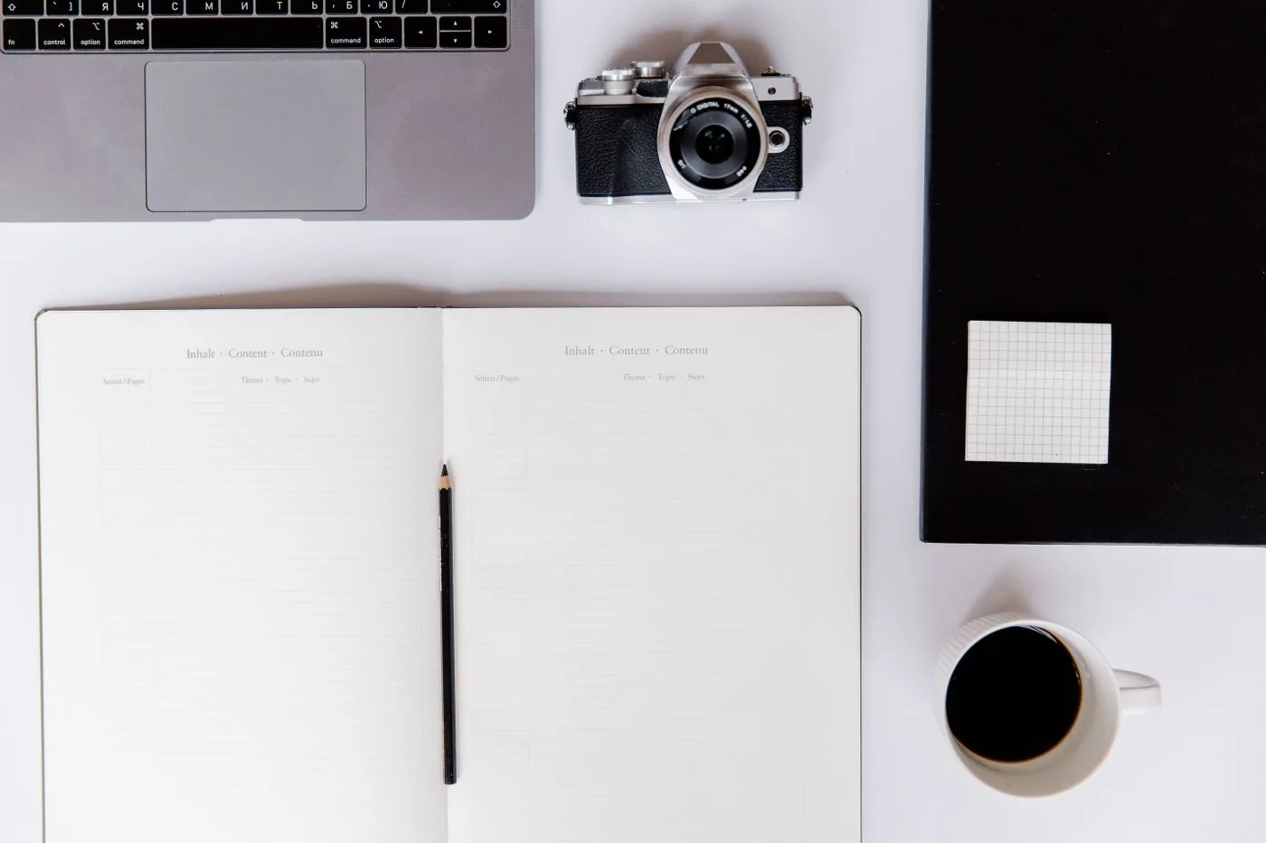 A content workspace with camera and notebook