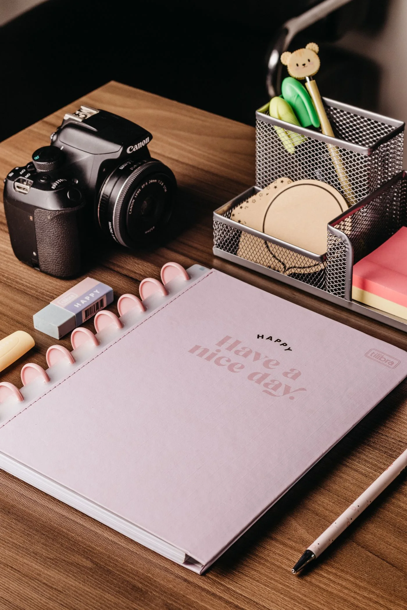 Camera and notes arranged on a desk