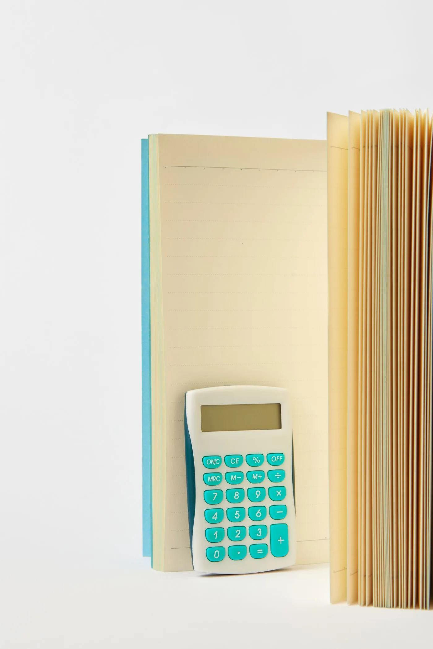 A calculator between notebooks